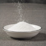 Sodium carbonate (Na₂CO₃) is a dense alkali (99.5%).